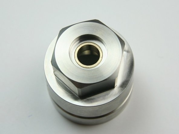 Make sure the swivel bearing is flush with the top of the cavity.