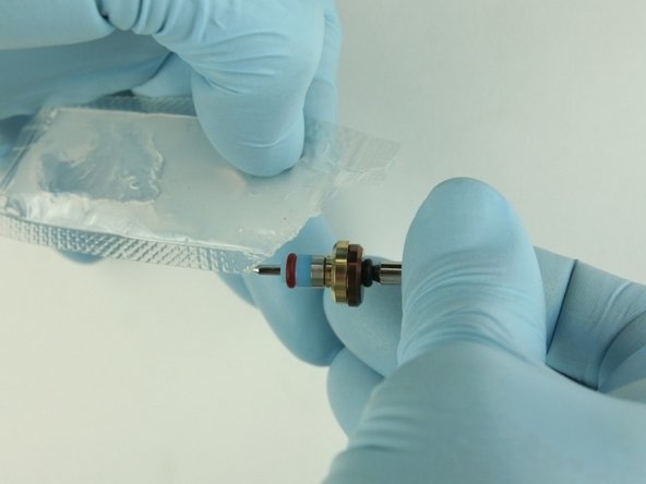 Apply high-pressure lubricant to the  outside diameter of the high-pressure valve seal.