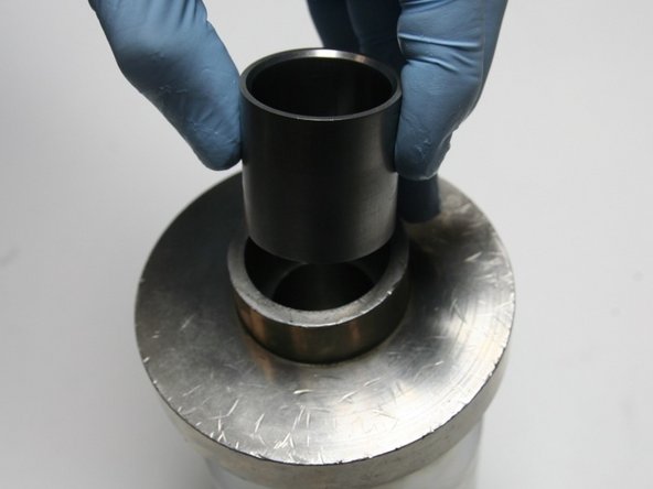 Put the installation sleeve into the sleeve guide with the larger ID, with the tapered end, up.