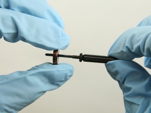 Slide the stainless steel back-up ring on to the valve stem point with the chamfer side towards the O-ring.