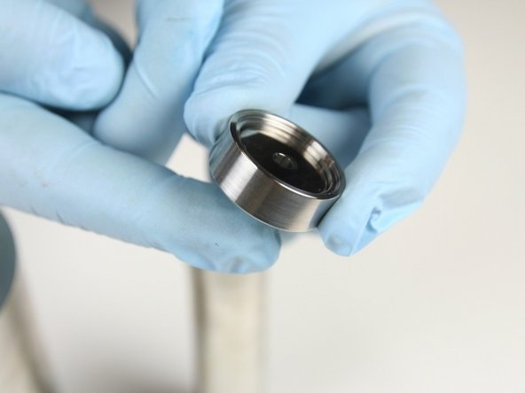 Make sure that the low-pressure poppet moves freely in the low-pressure poppet basket.