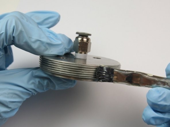 Apply lithium grease to the threads of the actuator cap.