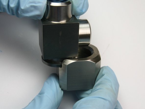 Slide the collar out from the swivel housing.