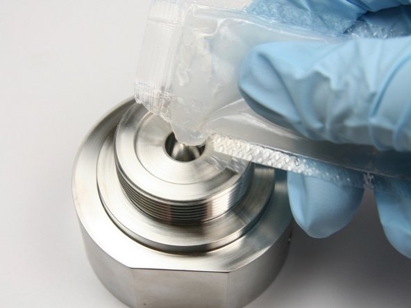 Apply a layer of high vacuum grease into the cavity of the seal half of the swivel housing.