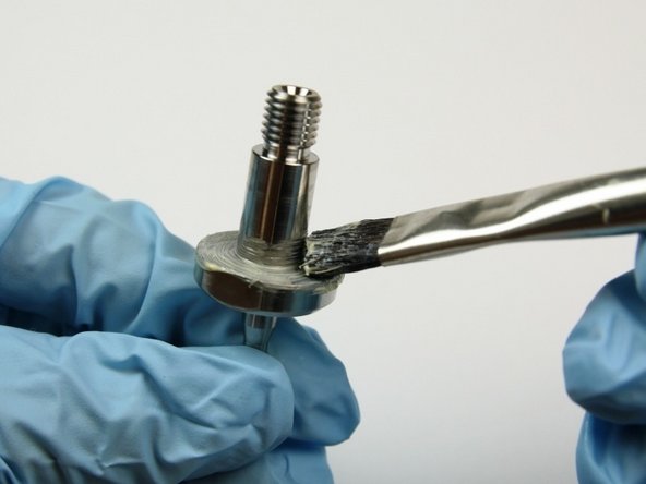 Apply lithium grease to the base of the swivel shaft.