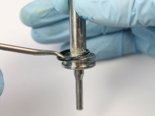 Remove the O-ring from the groove of the swivel shaft with a pick.