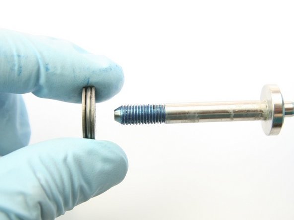 Remove the thrust washers and the thrust bearing from the swivel shaft.