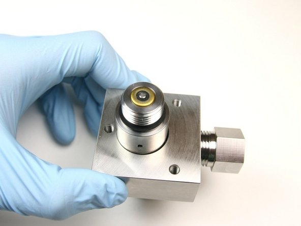 Put the stem through the high-pressure seal until it is flush with the oil seal.