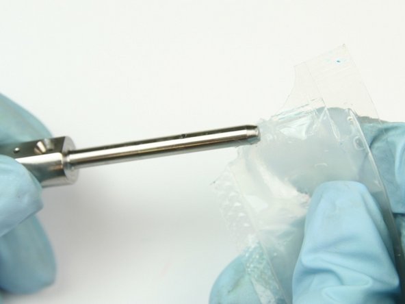 Apply a thin layer of high-vacuum grease to the swivel shaft.