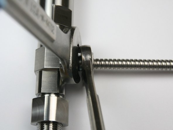 Tighten gland nut to side of bleed down valve body with....