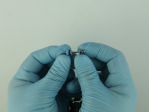 With the O-ring towards the point of the poppet stem, slide the  high-pressure valve seal on to the poppet stem.