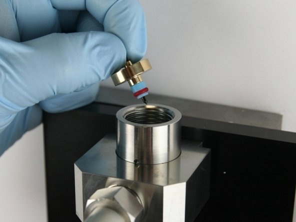 Put the needle point at the top of the valve body.