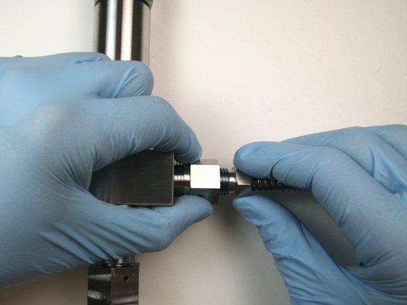 Thread the gland nut into the outlet fitting (connected to the collar).