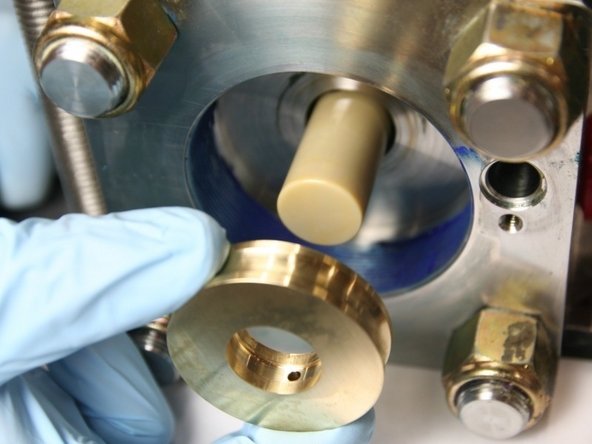 Replace the bronze back-up with the new disc from the kit onto the plunger.