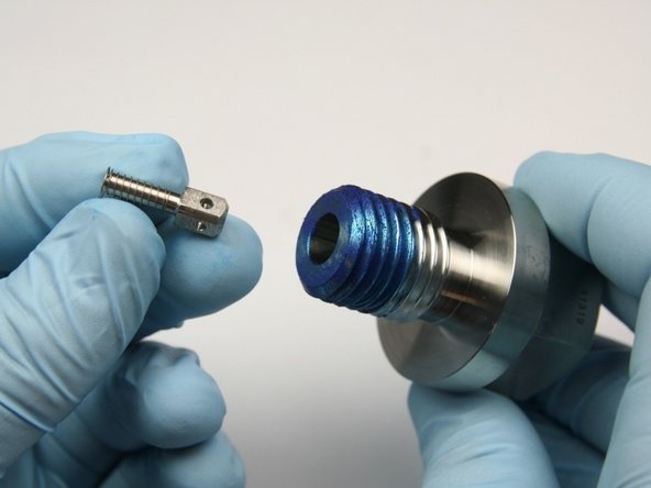 Insert the poppet pin with the high-pressure spring into the high-pressure sealing head gland.