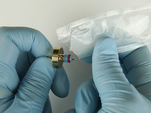 Apply high vacuum grease to the outside diameter of the high pressure valve seal.