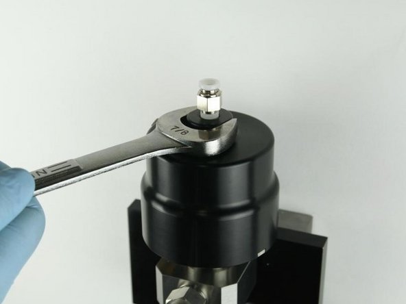 Tighten the actuator to the valve body using a 7/8&quot; wrench.