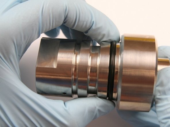 Slide on the first O-ring to the inner groove of the check valve body.