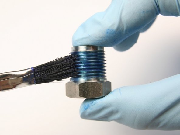 Apply Blue Goop to the high-pressure gland threads.