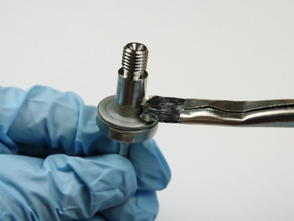 Apply lithium grease to the top of the thrust washer.