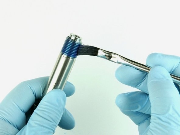 Reapply Blue Goop to the threads of the nozzle tube.