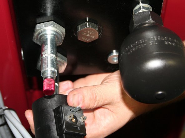 Remove both 24VDC coils from solenoids on back of old control manifold.