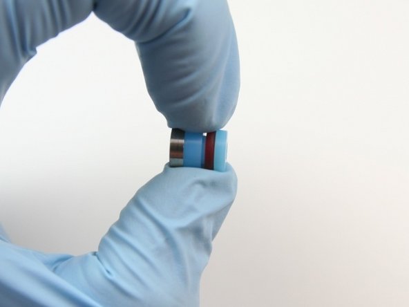 Place the hoop onto the high-pressure seal with the tapered end towards the high-pressure seal and opposite from the O-ring.