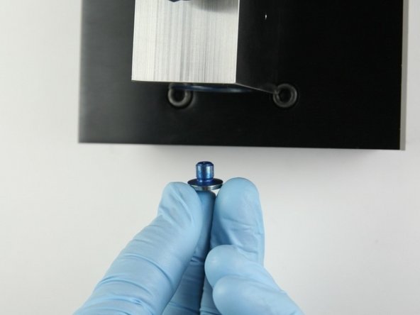 Put the seat into the bottom of the valve body.