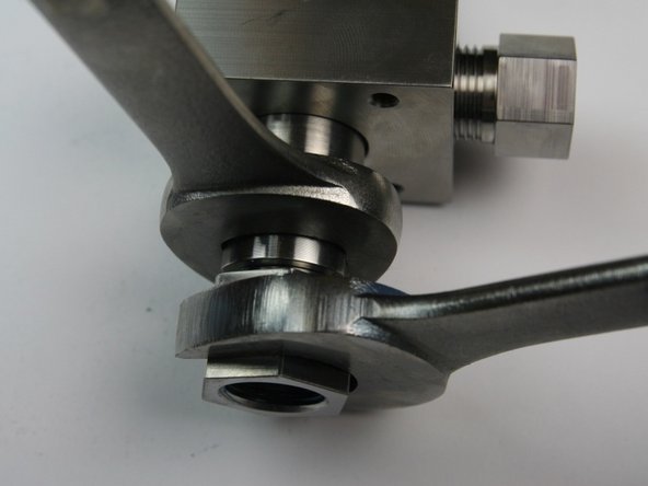 Tighten the outlet adapter to the valve body using a 7/8" and 13/16" wrench.