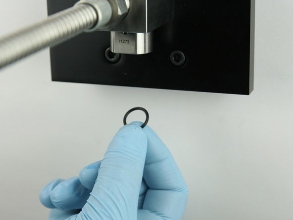 Put the O-ring behind the high-pressure seat so it is held in place.