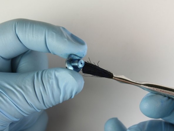 Apply Blue Goop to all surfaces of the seat.