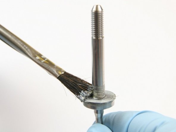 Apply lithium grease to the top of the first thrust washer.