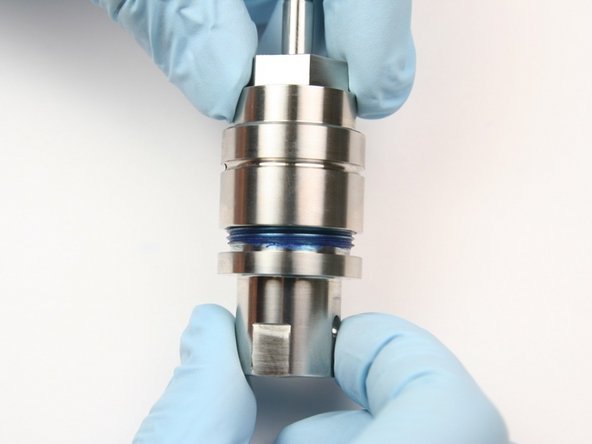 Thread the bearing half of the swivel housing onto the seal half of the swivel housing.