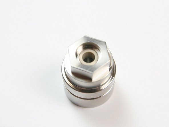 Be sure that the swivel bearing is flush with the bottom of the cavity of the bearing half of the swivel housing.