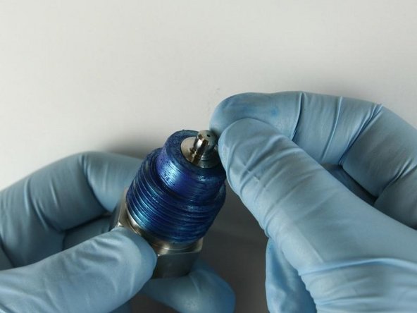 Put the seat into the top of the high-pressure gland fitting with the flat side towards the gland fitting.