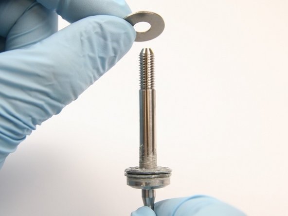 Put the second thrust washer onto the swivel shaft.