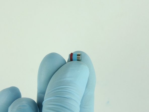 Put the hoop on the  high-pressure seal with the sharp edge of the hoop towards the seal.