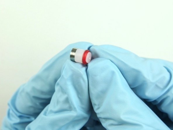 Put the hoop on the  high-pressure seal with the sharp edge of the hoop towards the seal.