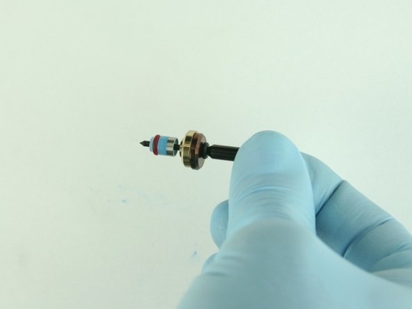 Slide hoop and the high-pressure valve seal onto the valve stem with the hoop towards the brass back-up ring.