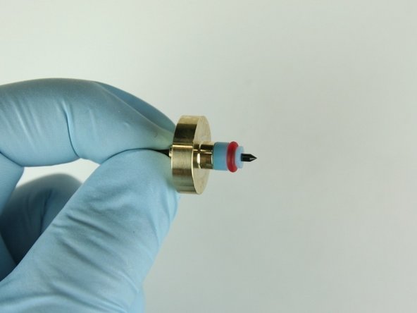 Slide the high-pressure valve seal onto the needle point.