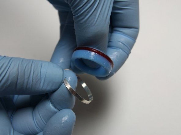 Put the hoop onto the seal with the sharp (tapered) end towards the seal.