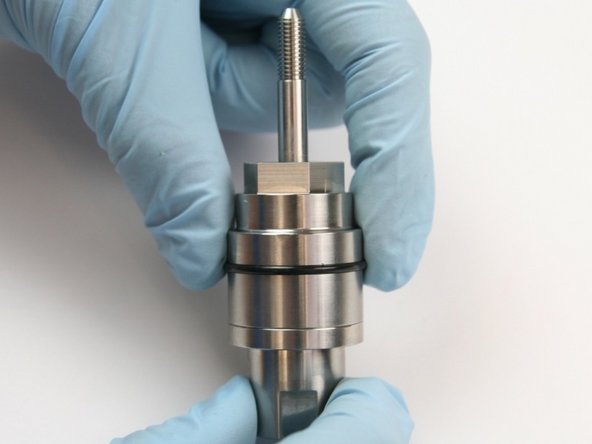 Put the O-ring over the swivel shaft and into the groove of the swivel body.