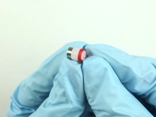 Put the hoop on the high-pressure seal with the sharp edge of the hoop towards the seal.