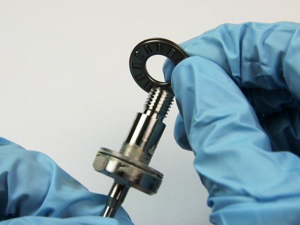 Place the thrust bearing onto the swivel shaft.