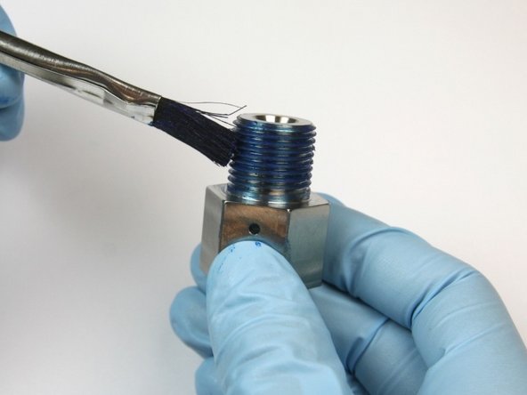 Apply Blue Goop to the outlet adapter threads.