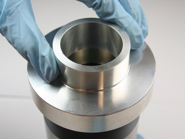 Thread the seal guide tool onto the dynamic side of the high-pressure cylinder.
