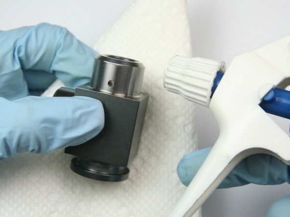 Clean the swivel housing of all Blue Goop with isopropyl alcohol.