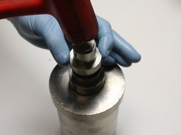 Secure the hoop in place by tapping the installation tool with a rubber mallet until the tool bottoms out on the guide.