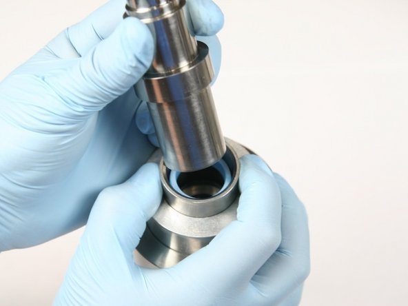 Press HP seal into cylinder using non-stepped end of push tool