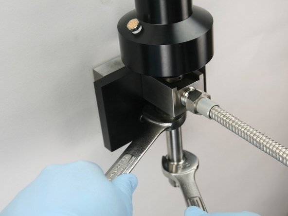 Tighten the nozzle tube to the valve using 3/4&quot; and 7/8&quot; wrench.